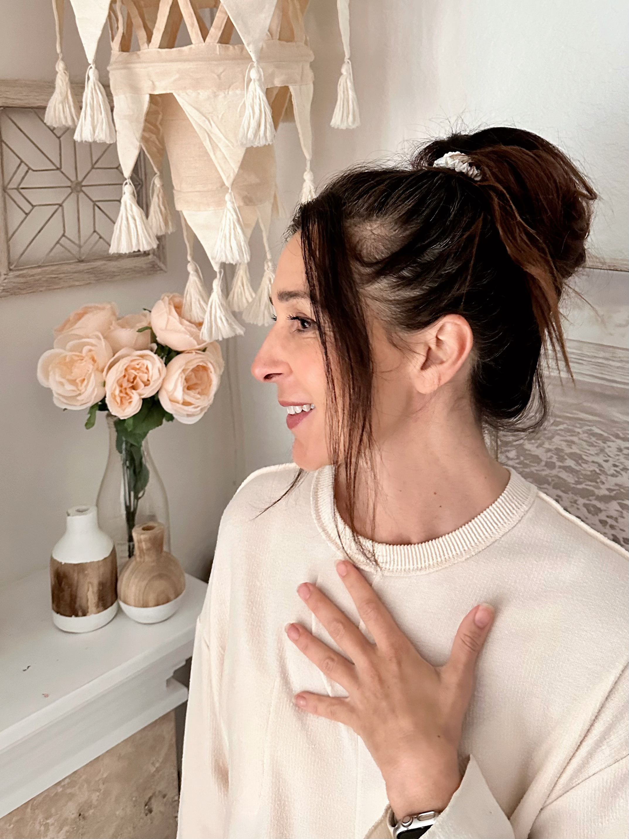 Woman wearing Kloven silk scrunchie in a messy bun