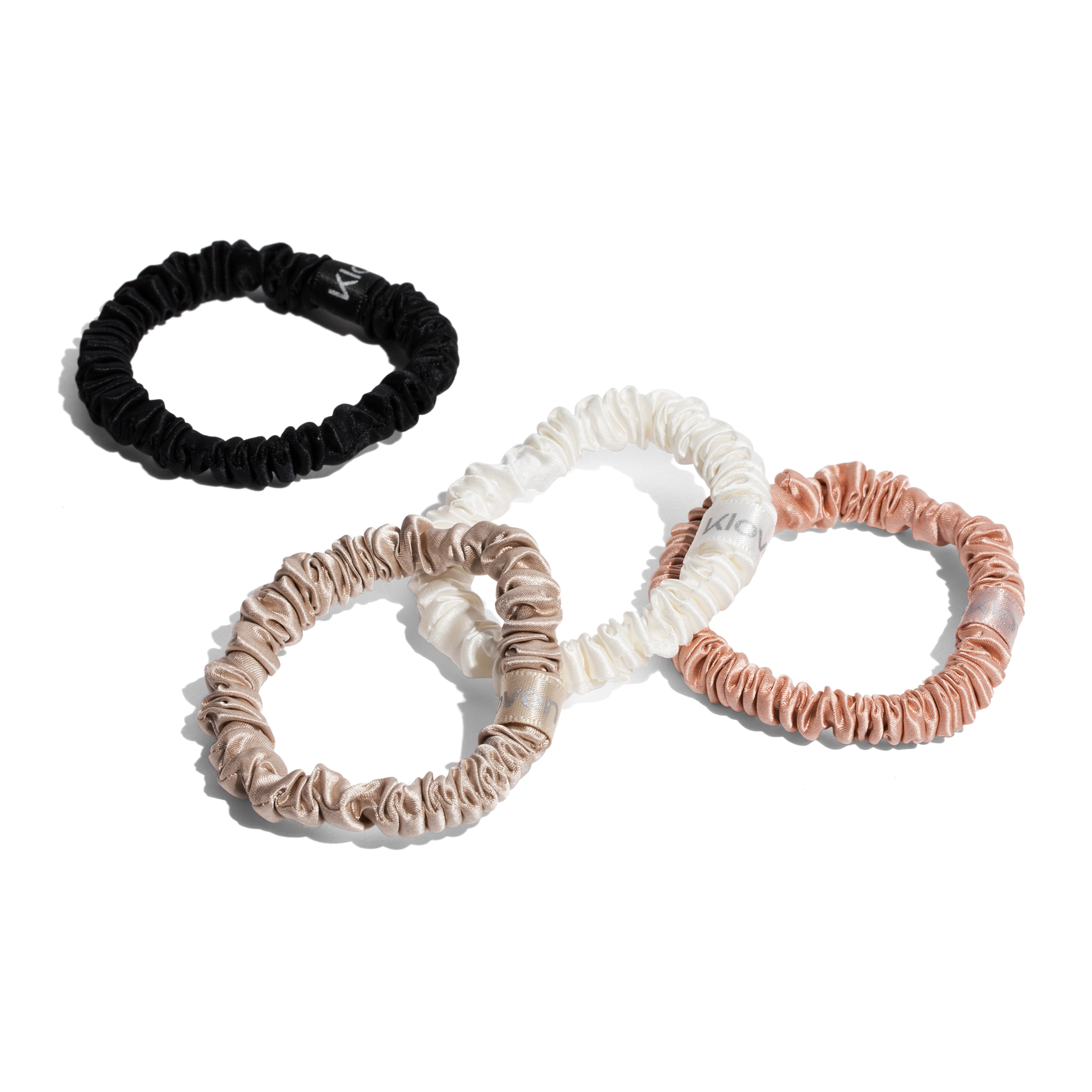 Four Kloven silk scrunchies flat lay in all colors